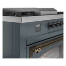 Blue-grey dual fuel range control panel with digital display and bronze handle detail.
