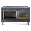 Blue grey dual fuel range with brass-trimmed doors, left oven open and right oven closed.