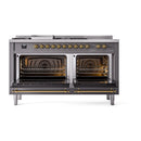Dual-fuel range with two open ovens showing racks and heating elements, brass trim visible