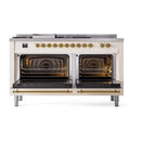 Antique white range with two open ovens and brass lower front trim