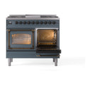 ILVE blue grey dual fuel range with both oven doors open, bronze trim, and warm-lit interiors