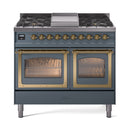 Blue grey dual fuel range with both ovens open, brass-trimmed doors with lit interiors