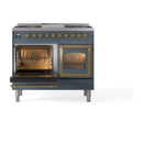 Blue grey dual fuel range with left oven door open, interior racks visible, brass accents