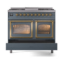 Blue grey dual fuel range with two glass oven doors closed, brass handles and controls