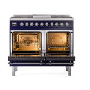 Midnight blue dual fuel range with chrome-trimmed ovens; oven interiors lit