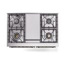 Gas cooktop with four burner grates and a central cover panel, close-up