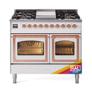 Dual fuel range front view with two closed ovens, top gas burners, and copper control knobs