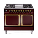 Burgundy dual-fuel range with two solid oven doors, brass accents, and control knobs