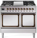 Stainless steel dual fuel range with solid door ovens and bronze trim.