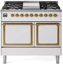 White dual-fuel range with brass trim, dual solid-door ovens, and front burner knobs