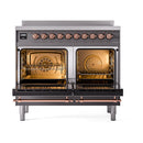 Matte graphite induction range with both ovens open, copper heating elements and racks