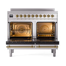 Stainless steel induction range with both oven doors open and brass trim