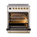 Open oven cavity with brass-trim frame and interior bake and broil elements