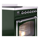 Emerald green induction range control panel with chrome knobs and open oven door