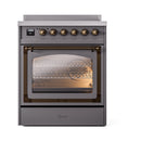Matte graphite induction range with bronze-trim knobs and lit oven interior