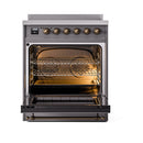 Matte graphite induction range oven interior with racks and bronze knob controls