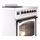 White induction range side view with bronze control knobs and oven door window