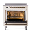 36-inch induction range with open triple-glass oven door, antique white and bronze trim