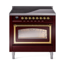 Burgundy induction range with triple-glass oven door and brass trim, front view
