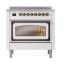 White induction range with bronze-trim oven window door and row of front control knobs