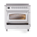 White oven with triple-glass window, chrome handle, control panel above