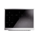 Induction cooktop glass panel with burner-zone markings on dark surface