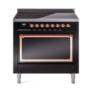 Black induction range with open oven door and copper trim across the top bar