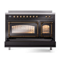 Glossy black induction range with triple glass doors and bronze-trimmed controls, open.