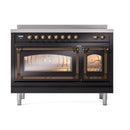 Glossy black induction range with triple glass doors and bronze-trimmed knobs, open.