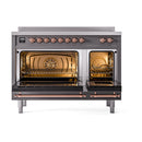 Induction range with both oven doors open, showing lit interiors and copper door trim