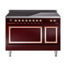 Burgundy induction range with two open oven doors, copper frames, and control knobs