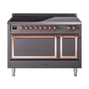 Induction range with front knobs, copper trim, and two closed oven doors