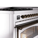 Stainless steel range control panel with bronze knobs and digital display