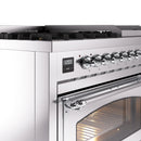 Stainless steel dual-fuel range control panel with round chrome knobs and oven door