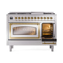 Stainless steel freestanding dual fuel range with brass trim, open right oven door, knobs on front