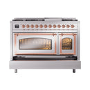 Stainless steel range with copper trim; both oven doors closed with interior lighting