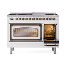 White dual-fuel freestanding range with lit left oven window and open right door