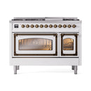 White dual-fuel freestanding range with lit oven windows and bronze control knobs