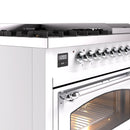 Chrome control knob row with digital display on white dual-fuel gas range