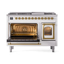 White range with oven interior visible through brass-trim door windows