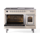 Antique white dual-fuel range with both oven doors open, chrome handles, interior racks