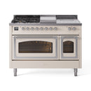 Antique white dual-fuel range with burner grates and both ovens open, glass viewing windows