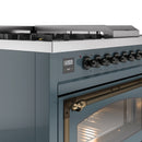 Blue-grey range control panel with knobs and display; oven door handle and warm interior