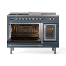 Blue gray range with both oven doors open, interior lighted with racks visible