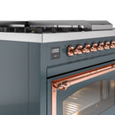 Blue grey gas range control panel with copper knobs and blue digital display window.