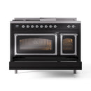 Glossy black dual fuel range with chrome-trimmed doors and lit double oven windows