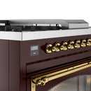 Burgundy range control panel with brass knobs and digital display