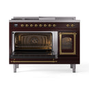 Burgundy gas range with brass trim, dual ovens open and oven racks visible