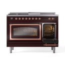 Burgundy dual-fuel range with one oven door open and copper-trimmed glass windows