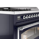 Midnight blue dual fuel range control panel with chrome knobs and oven handle